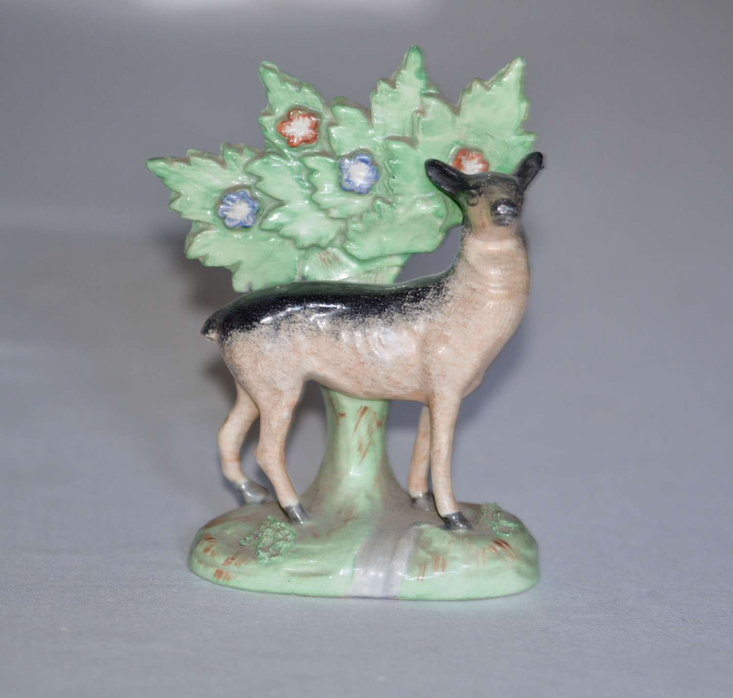A 19th Century Staffordshire model of a Black and Tan Deer
