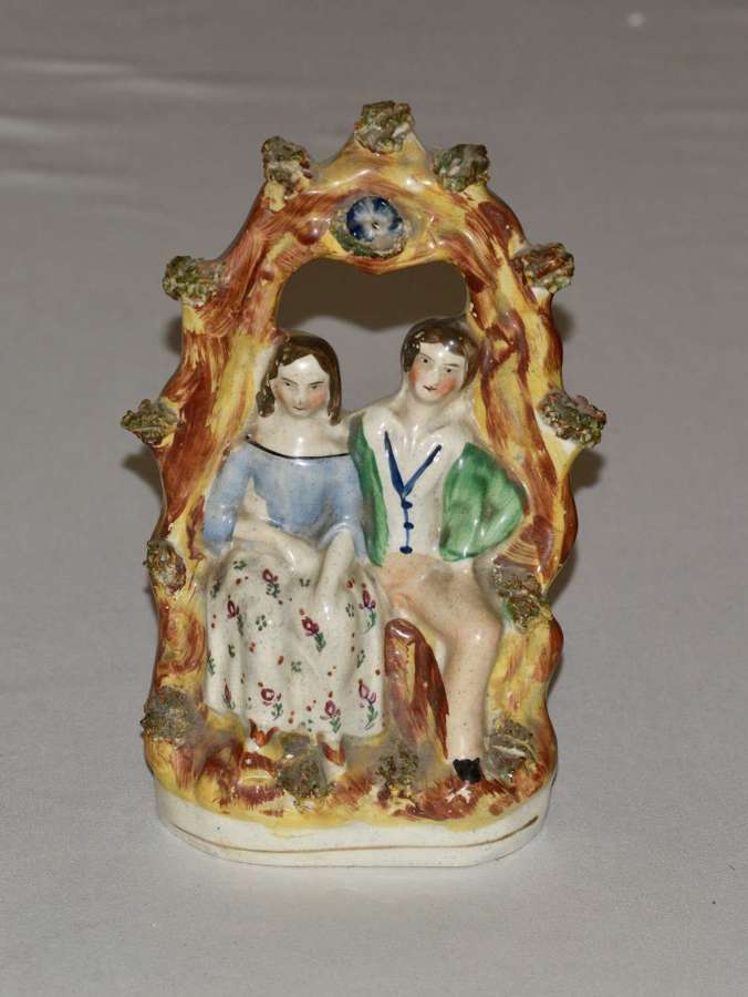 A 19th Century Staffordshire Figure of a Courting Couple Under a Bough